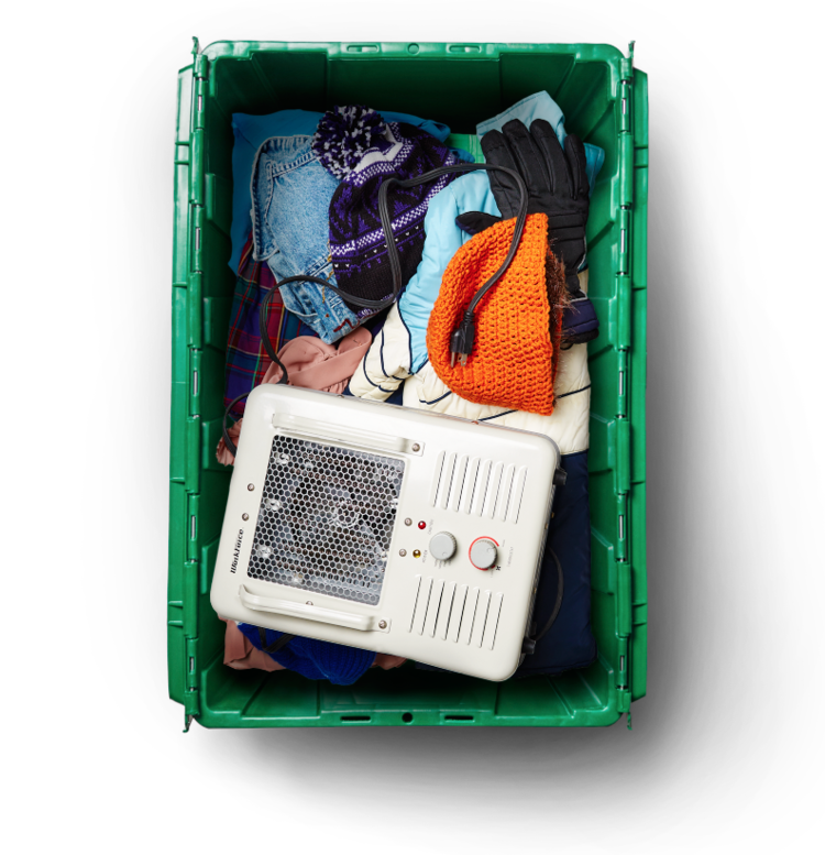 Professional organizer Beth Penn's MakeSpace storage bin stores her winter clothes and accessories and space heater.